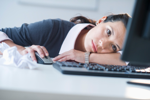 USA, New Jersey, Jersey City, Businesswoman in front of computer, looking tired